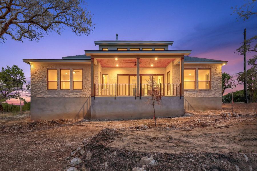 Back of property with covered patio and private views of greenbelt