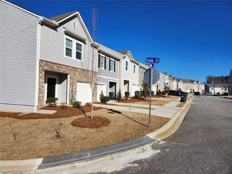 Front exterior of a new home in , Atlanta, GA, highlighting curb appeal (Image 1).