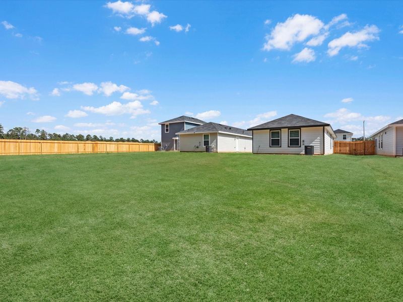Exterior details and patio area of a home in William Trails, Willis (Image 19).