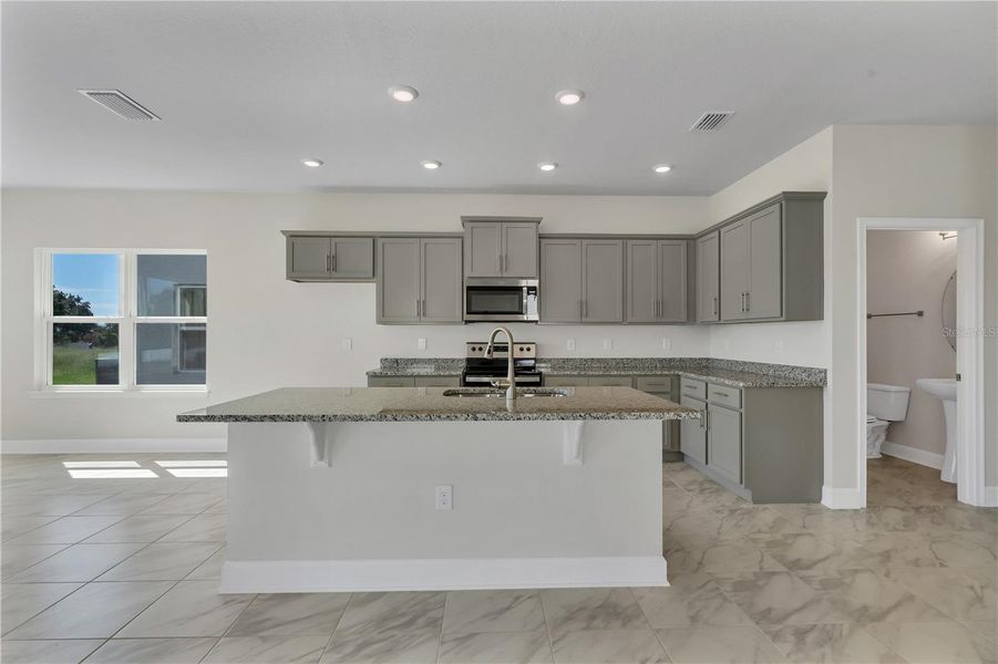 Representative furnished interior of a home built from the 2202- by Adams Homes in Winding Oaks, Weeki Wachee (Image 6).