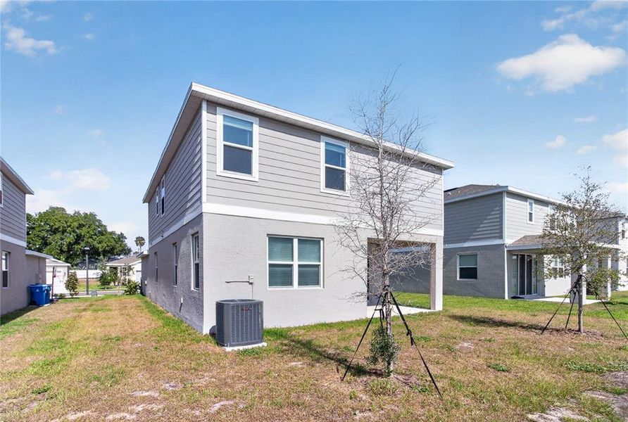 Exterior details and patio area of a home in Seasons at Forest Creek, Haines City (Image 4).