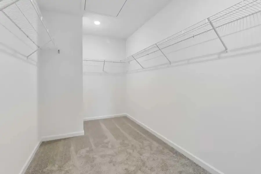 Representative Photo: Primary Bedroom Walk-In Closet Representative Photo: Primary Bedroom Walk-In Closet