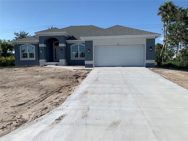 Front exterior of a new home in Rotonda, Rotonda West, FL, highlighting curb appeal (Image 16). Front exterior of a new home in Rotonda, Rotonda West, FL, highlighting curb appeal (Image 16).