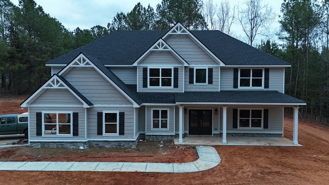 Front exterior of a new home in Williams Mill, Zebulon, GA, highlighting curb appeal (Image 5).