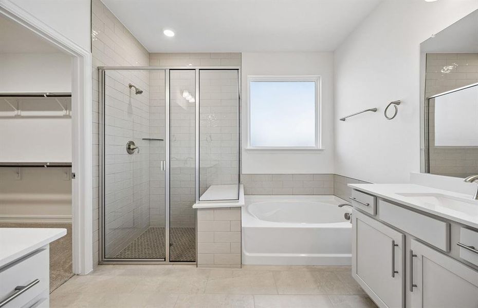 Owners bath with separate tub and shower