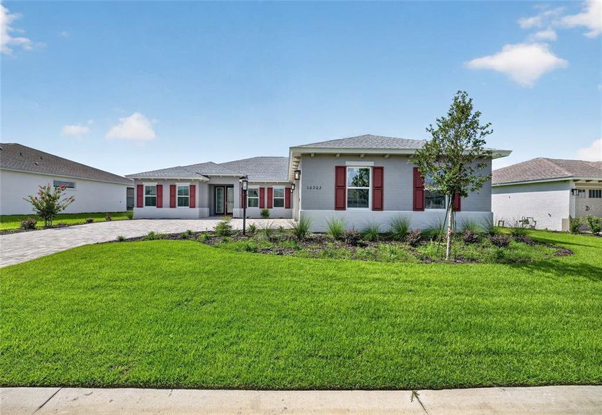 Front exterior of a new home in , Ocala, FL, highlighting curb appeal (Image 2). Front exterior of a new home in , Ocala, FL, highlighting curb appeal (Image 2).