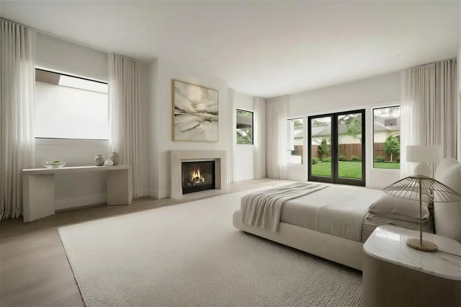 Rendering: Spacious first floor primary suite includes fireplace, large primary bath and closet, and a private patio.