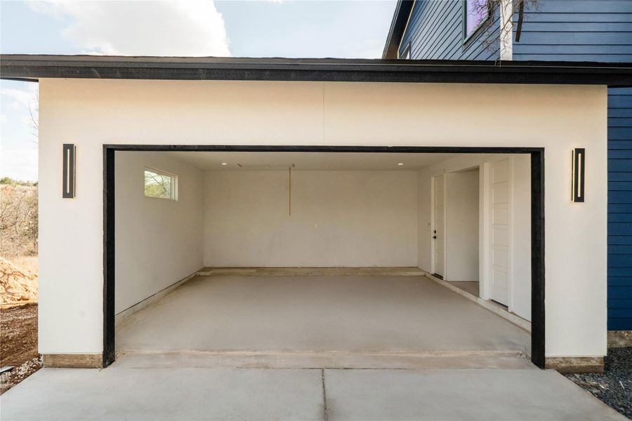 Garage featuring driveway