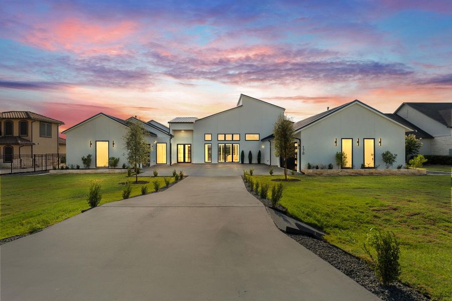Front exterior of a new home in , Dripping Springs, TX, highlighting curb appeal (Image 1). Front exterior of a new home in , Dripping Springs, TX, highlighting curb appeal (Image 1).