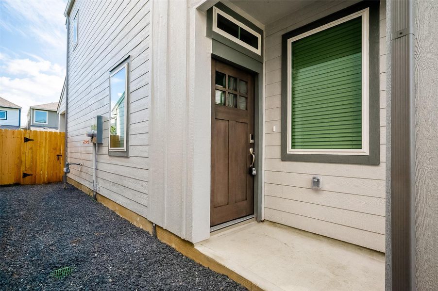 Front exterior of a new home in McClendon Park Village, Houston, TX, highlighting curb appeal (Image 2). Front exterior of a new home in McClendon Park Village, Houston, TX, highlighting curb appeal (Image 2).