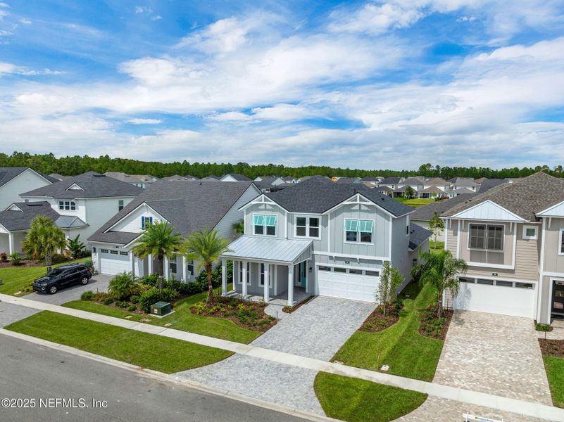Front exterior of a new home in Seabrook Village at Seabrook, Ponte Vedra, FL, highlighting curb appeal (Image 28).