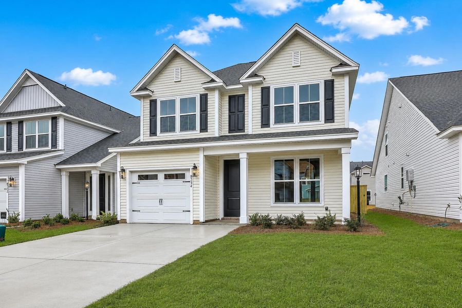 Front exterior of a new home in Windsor Crossing, North Charleston, SC, highlighting curb appeal (Image 2). Front exterior of a new home in Windsor Crossing, North Charleston, SC, highlighting curb appeal (Image 2).