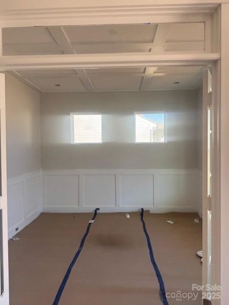 Office with French doors, faux coffered ceiling & wainscoting
