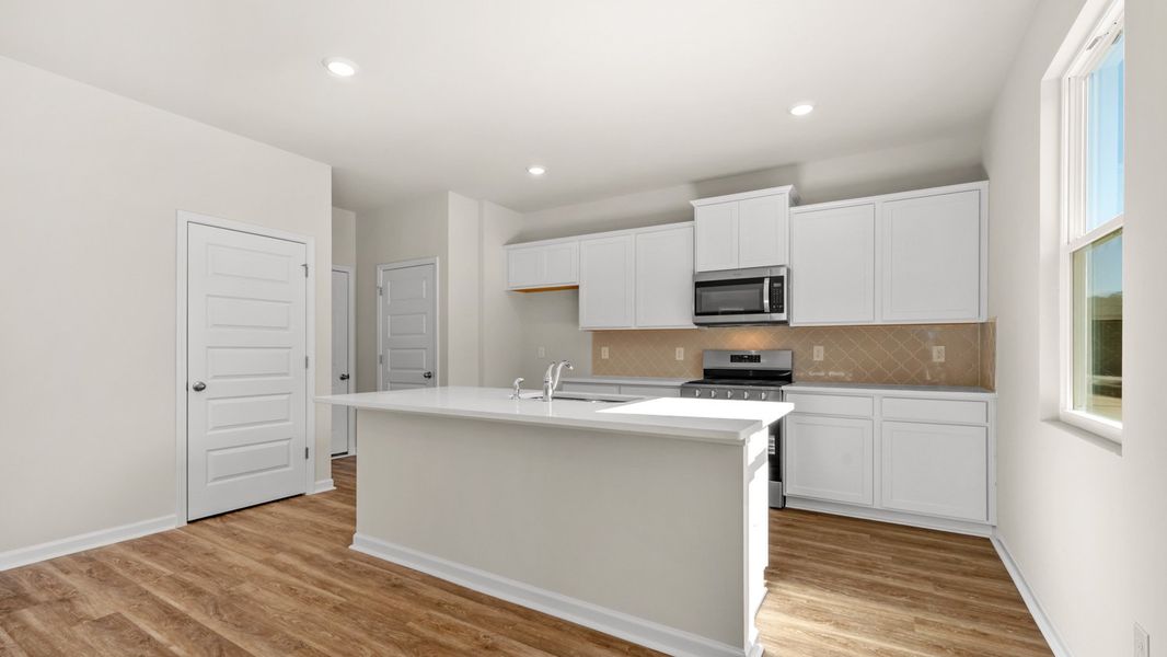 Representative furnished interior of a home built from the Flora by D.R. Horton in Poplar Preserve, Newnan (Image 6).