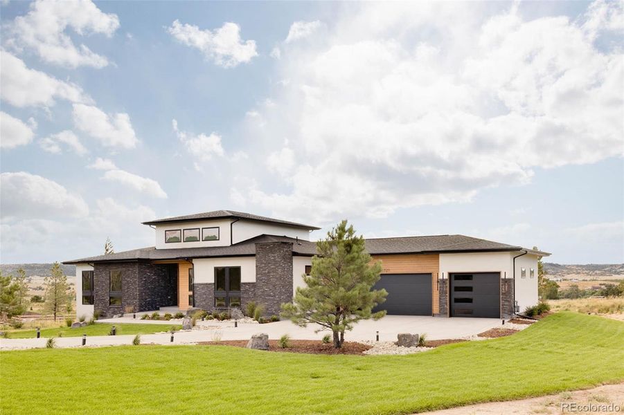 Front exterior of a new home in , Franktown, CO, highlighting curb appeal (Image 23).