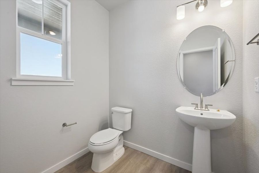 A bathroom with a sink and toilet. A bathroom with a sink and toilet.