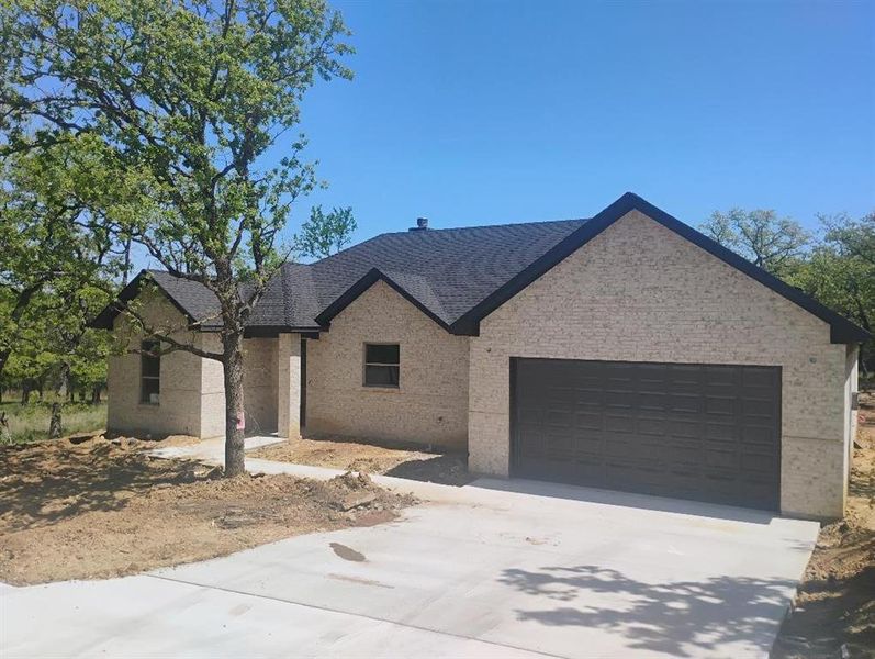 Front exterior of a new home in , Runaway Bay, TX, highlighting curb appeal (Image 13). Front exterior of a new home in , Runaway Bay, TX, highlighting curb appeal (Image 13).