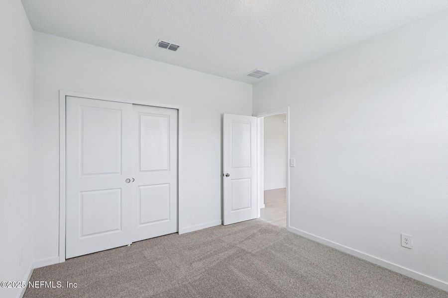 Spacious, unfurnished interior of a new home in Flagler Village - Signature Series, Palm Coast (Image 18).