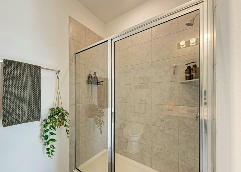 Bathroom featuring a shower stall Bathroom featuring a shower stall