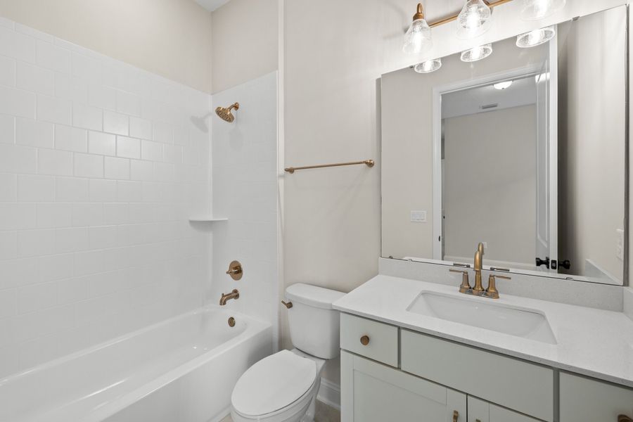 Representative furnished interior of a home built from the Aurora by Riverside Homes in Hidden Creek at SilverLeaf, St. Augustine (Image 17).