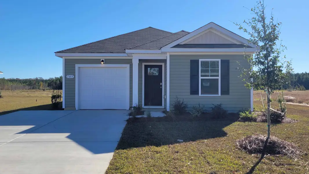 Front exterior of a new home in Southshore Bay, Sunset Beach, NC, highlighting curb appeal (Image 2). Front exterior of a new home in Southshore Bay, Sunset Beach, NC, highlighting curb appeal (Image 2).