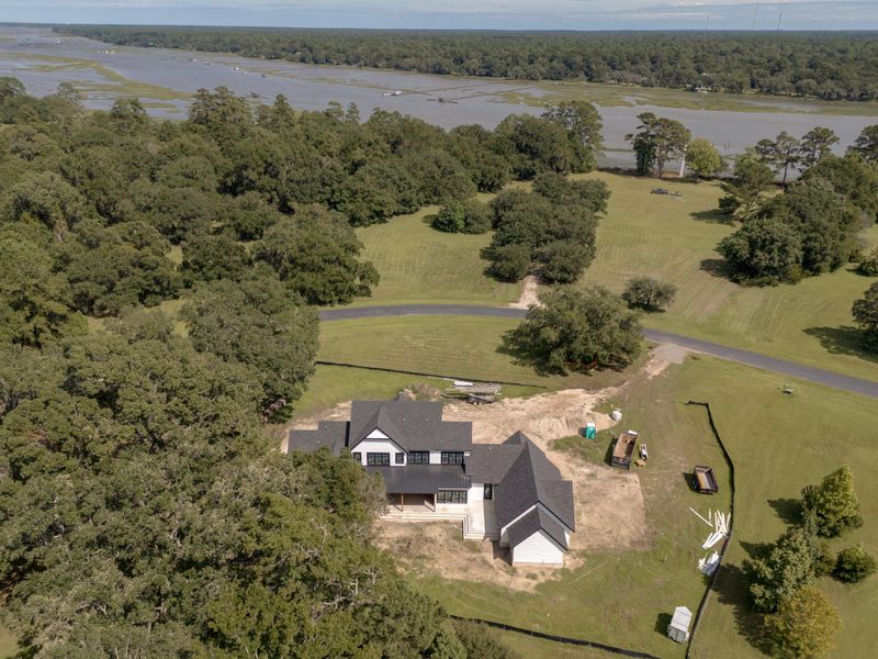 Front exterior of a new home in , Wadmalaw Island, SC, highlighting curb appeal (Image 12). Front exterior of a new home in , Wadmalaw Island, SC, highlighting curb appeal (Image 12).