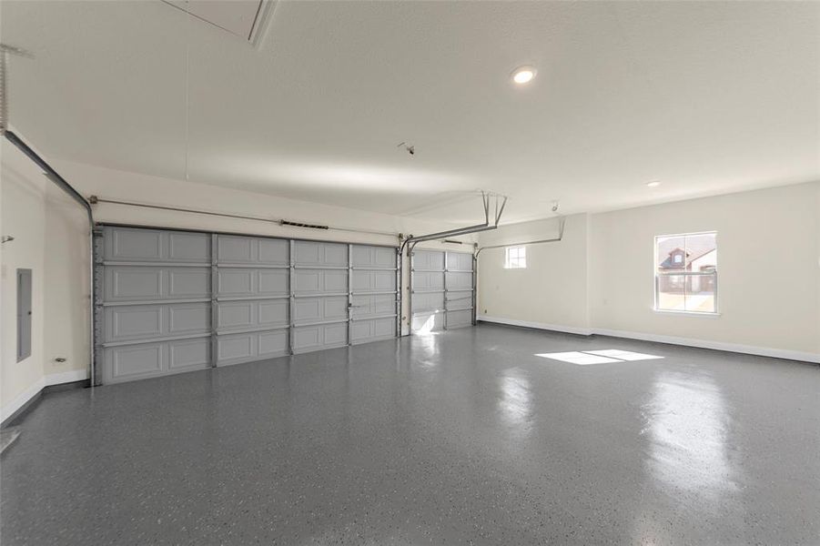 Garage featuring recessed lighting and electric panel Garage featuring recessed lighting and electric panel