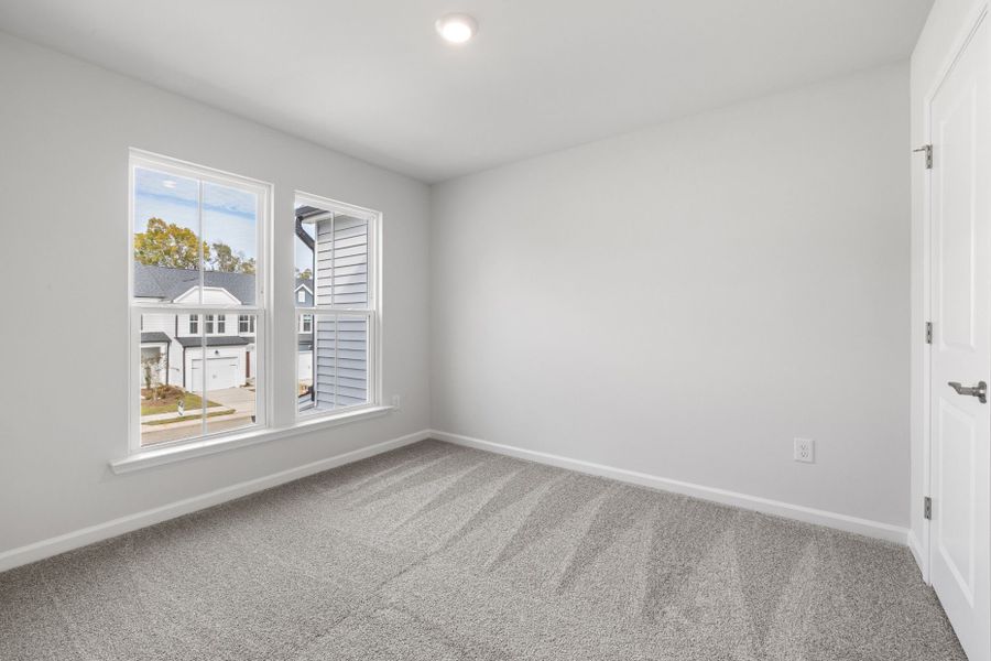 Spacious, unfurnished interior of a new home in Poets Walk, Whitsett (Image 18).