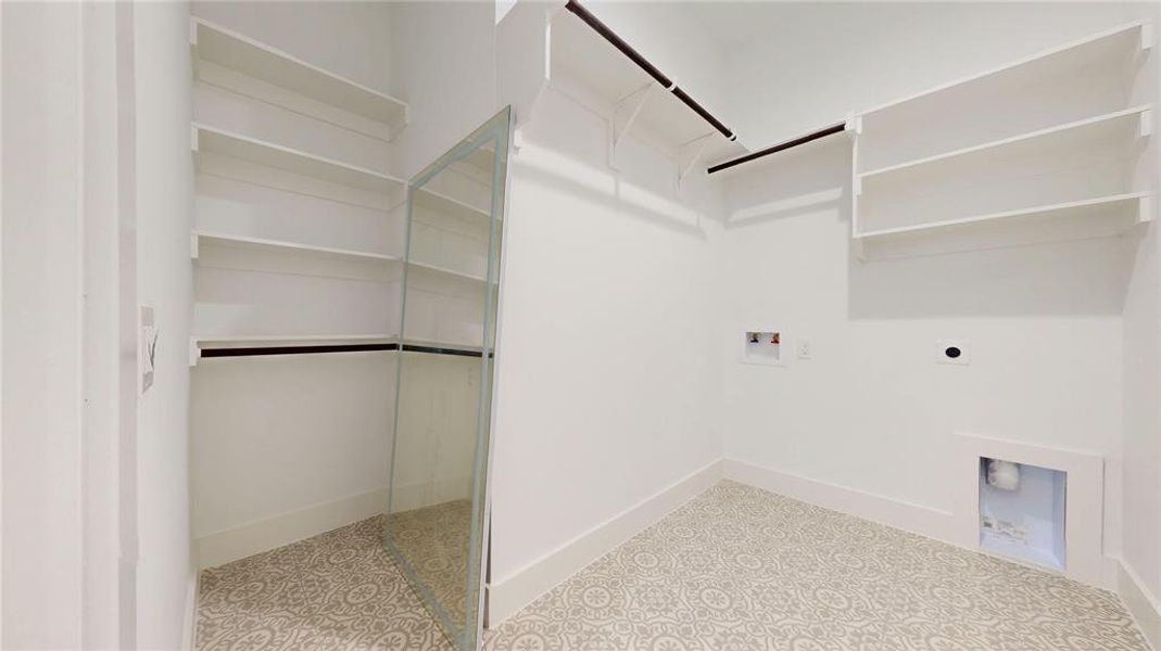 Downstairs Washroom featuring hookup for a washing machine and hookup for an electric dryer