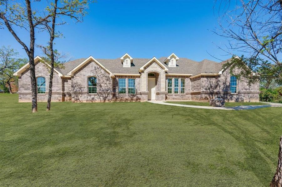 View of front of house featuring a front lawn