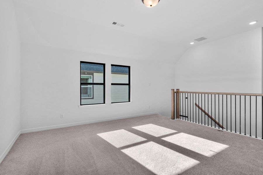 The gameroom provides an elevated living space perfect for gathering, lounging, or quiet reflection.