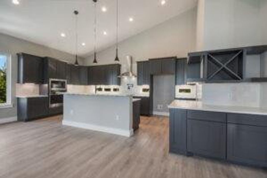 Kitchen with high vaulted ceiling,