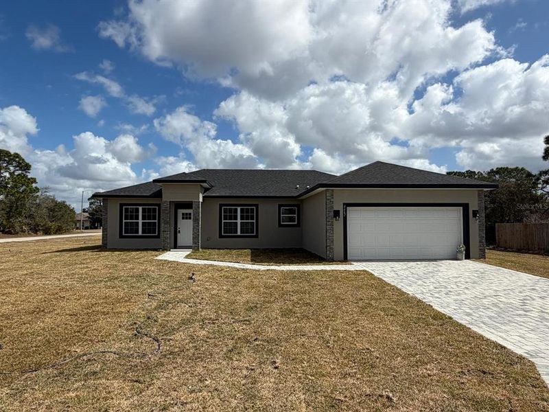 Front exterior of a new home in , Sebring, FL, highlighting curb appeal (Image 25).