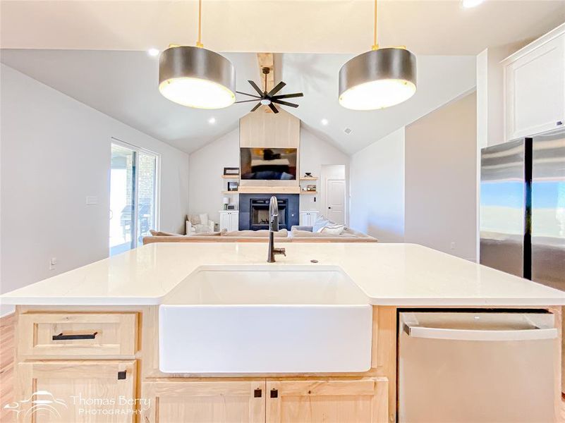 Open floor plan allowing for views of living area, dining area, and outdoors.
