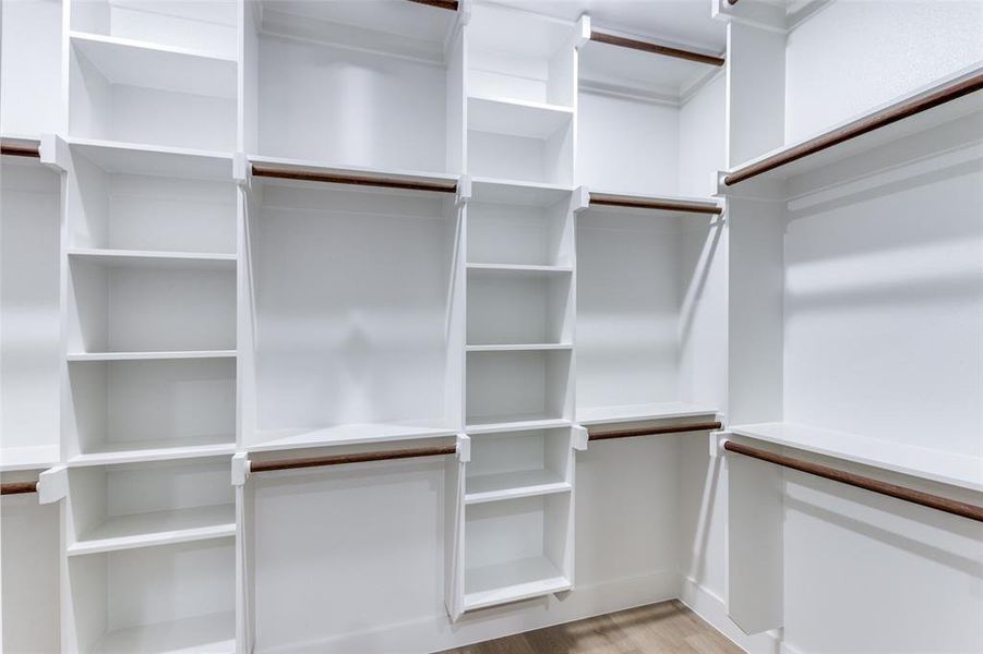 Spacious closet with wood finished floors