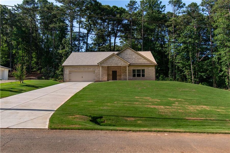 Front exterior of a new home in , Canton, GA, highlighting curb appeal (Image 2). Front exterior of a new home in , Canton, GA, highlighting curb appeal (Image 2).