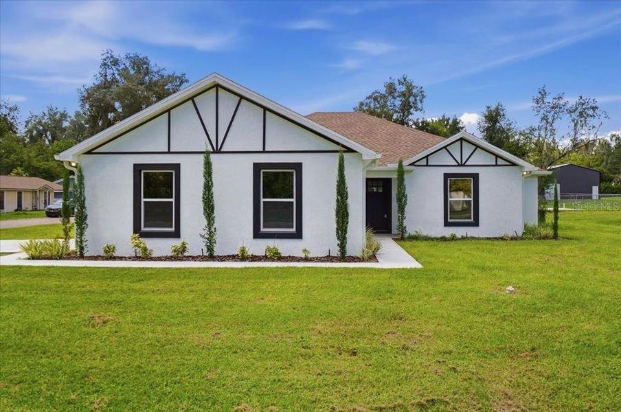 Front exterior of a new home in , Fort Meade, FL, highlighting curb appeal (Image 2). Front exterior of a new home in , Fort Meade, FL, highlighting curb appeal (Image 2).