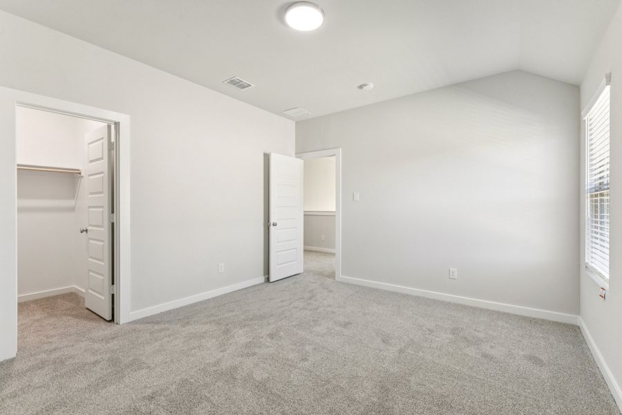 Bedroom in the Wimbledon home plan by Trophy Signature Homes – REPRESENTATIVE PHOTO