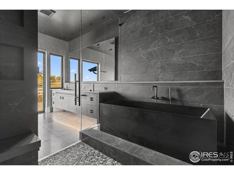 European style washroom w/ dual shower heads, full tile