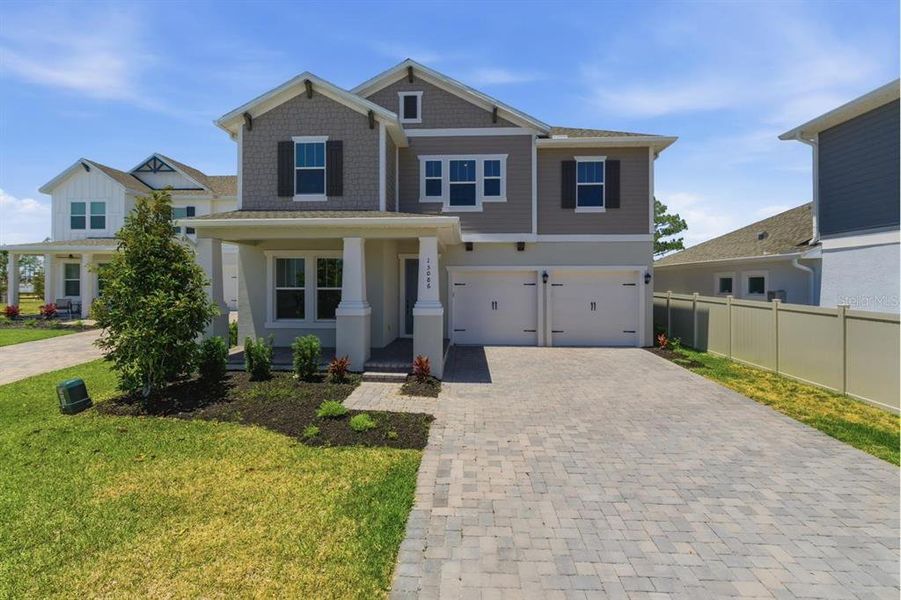 Front exterior of a new home in , Winter Garden, FL, highlighting curb appeal (Image 26).