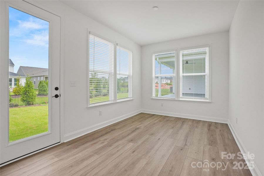 Airy sunroom off kitchen provides endless opportunities!