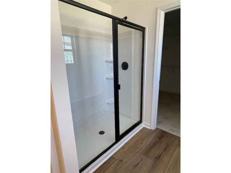 This modern shower with sleek fixtures provides a