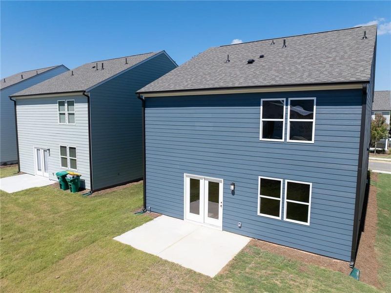 Front exterior of a new home in Annsbury Park, Lilburn, GA, highlighting curb appeal (Image 21). Front exterior of a new home in Annsbury Park, Lilburn, GA, highlighting curb appeal (Image 21).