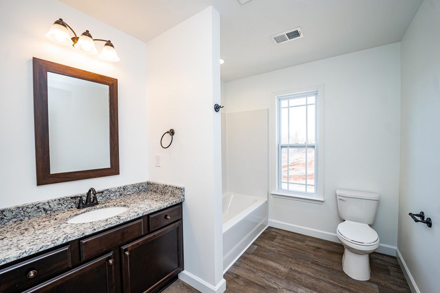 Representative furnished interior of a home built from the Sumter by Enchanted Homes in Lonesome Dove, San Antonio (Image 13).