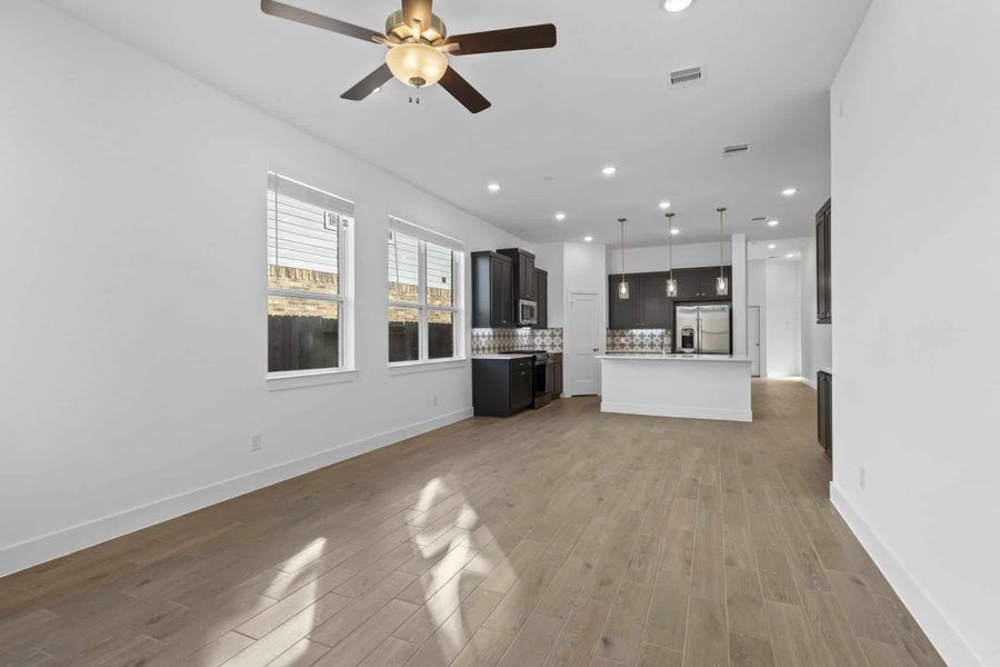 Representative unfurnished interior of a home built from the Adele by Chesmar Homes in Sunterra, Katy (Image 9).