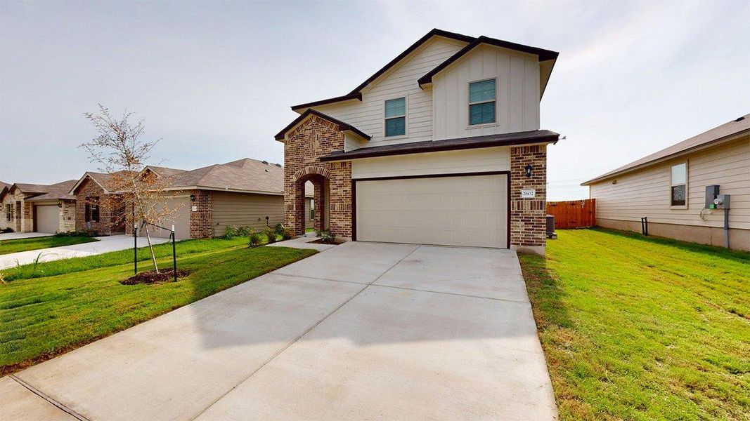 Front exterior of a new home in Pecan Creek, Temple, TX, highlighting curb appeal (Image 2).