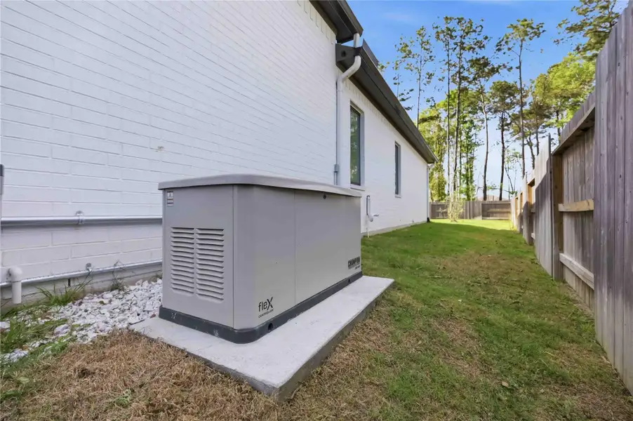 Exterior details and patio area of a home in Artavia, Conroe (Image 3).