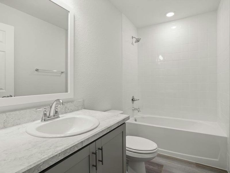 Secondary bedrooms share a hall bath.