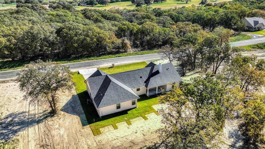 Front exterior of a new home in , Poolville, TX, highlighting curb appeal (Image 2).