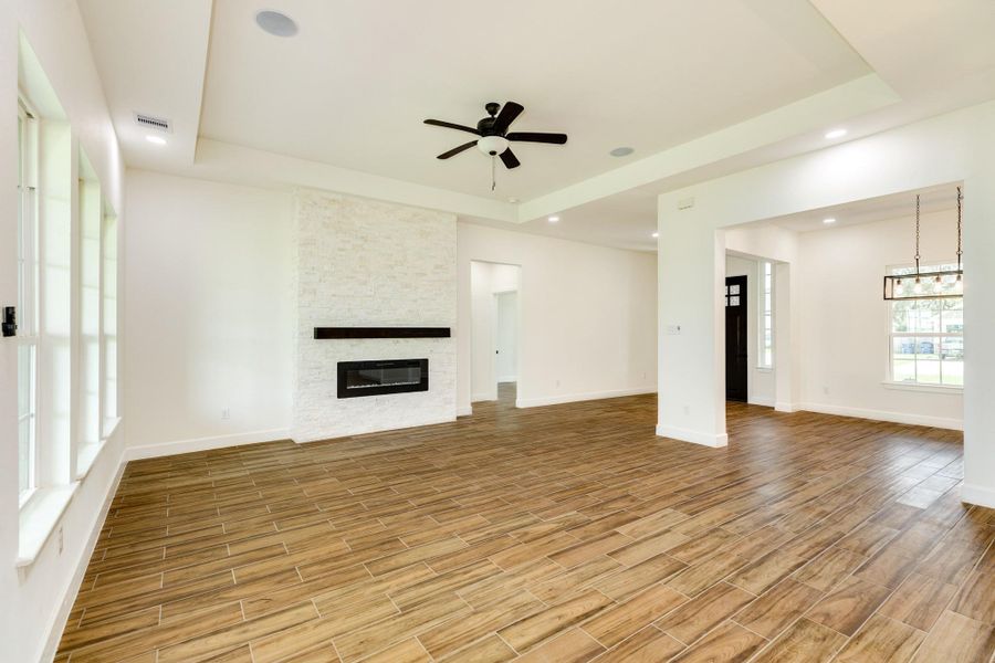 Floor to ceiling stone electric fireplace